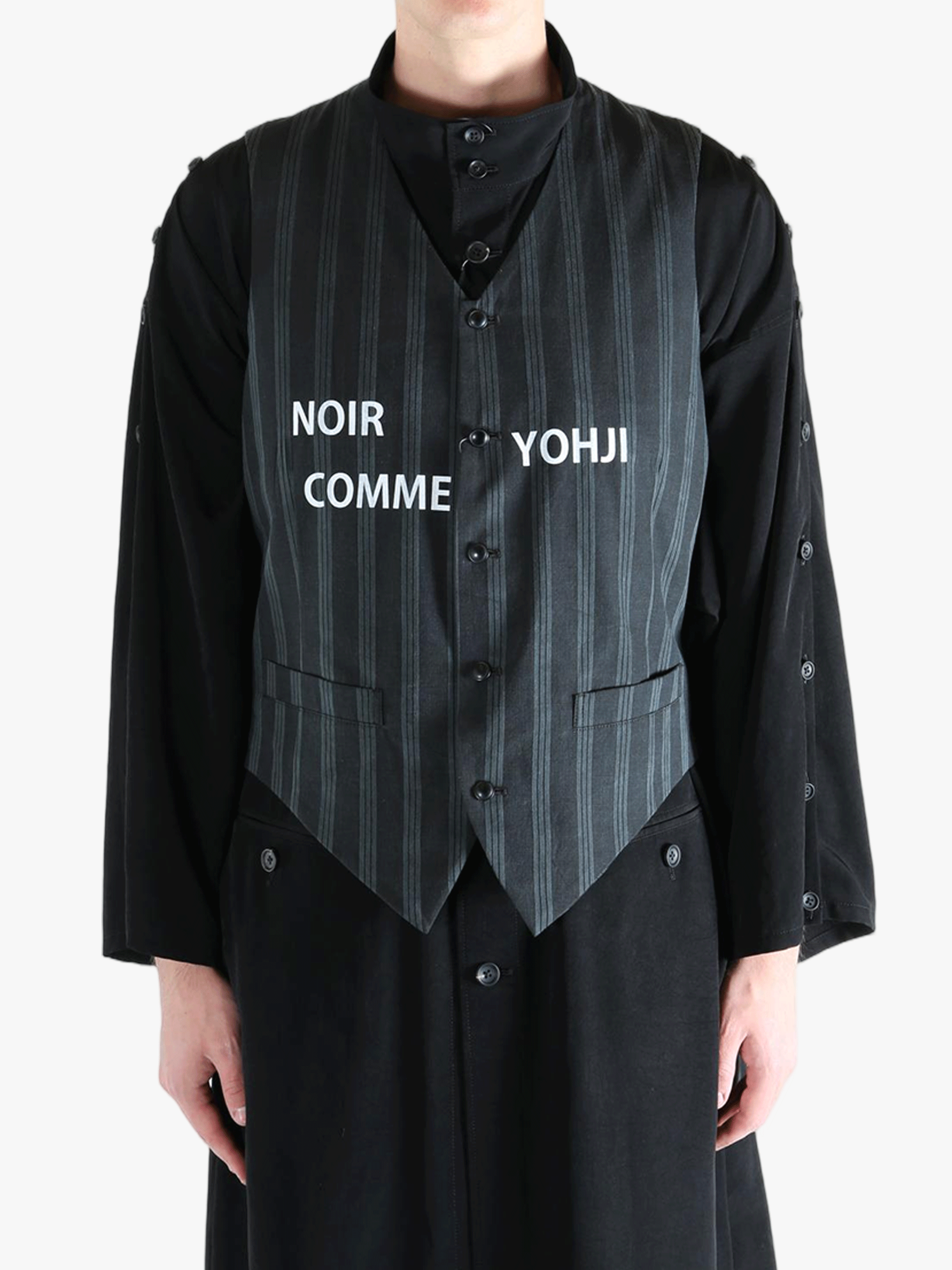 Black vest worn by a person, showing the vest's fit