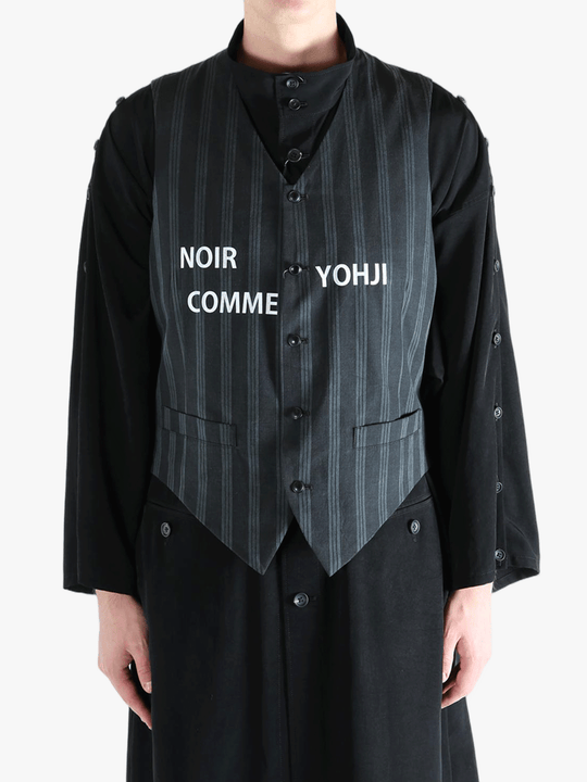 Black vest worn by a person, showing the vest's fit