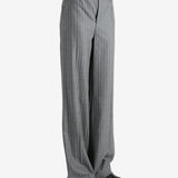 Grey pants worn by a person, showing the pant's fit