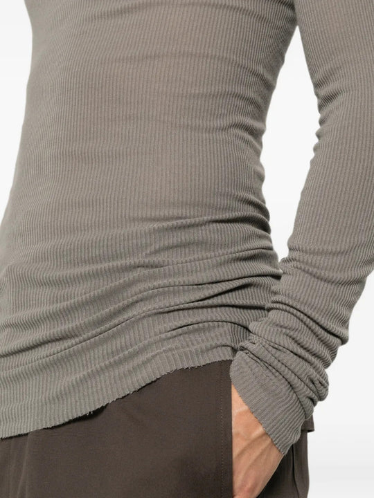 Grey t-shirt worn by a person, showing the t-shirt fit