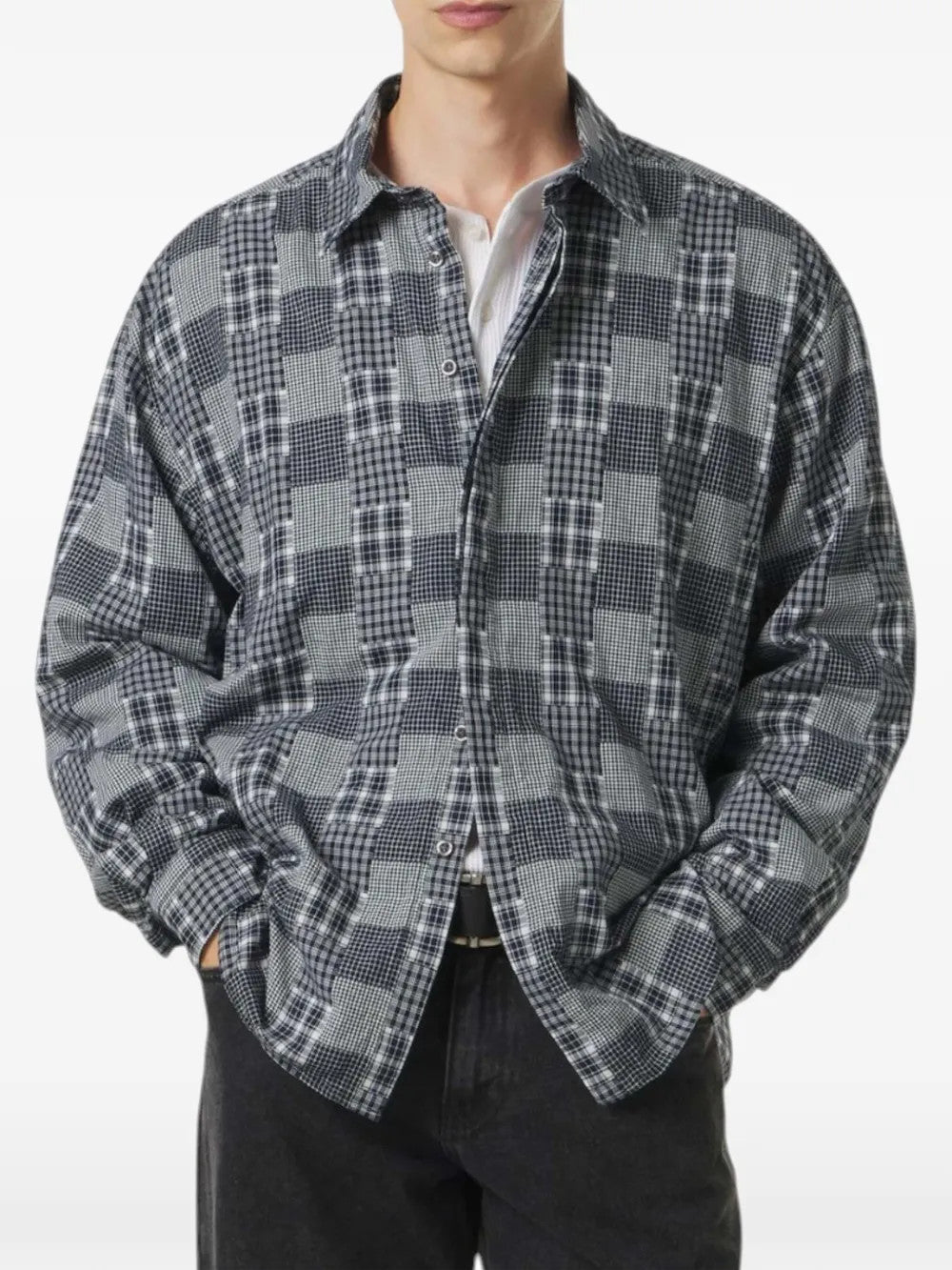 Grey shirt worn by a person, showing the shirt fit