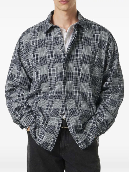 Grey shirt worn by a person, showing the shirt fit