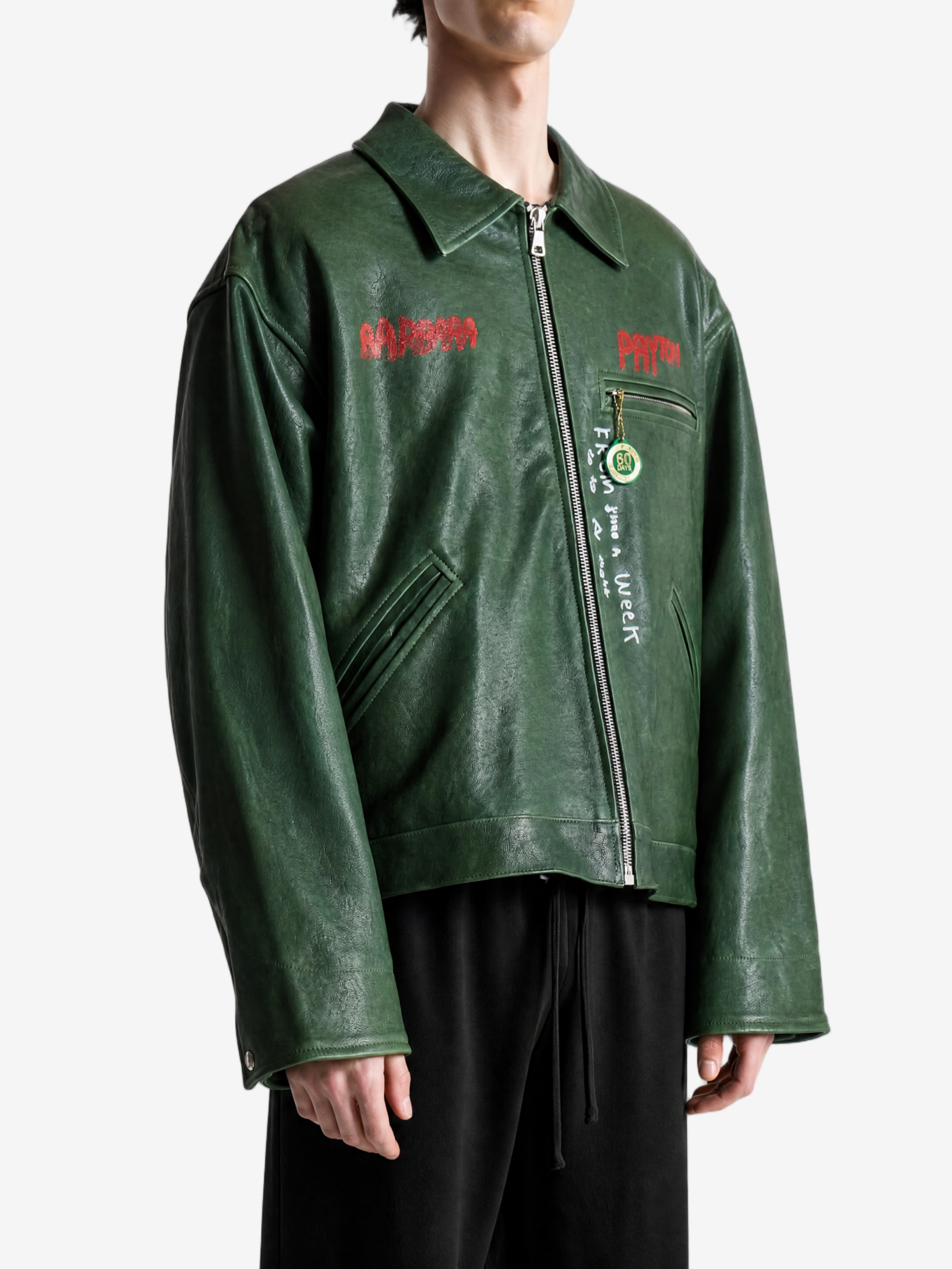 Green jacket worn by a person, showing the jacket fit