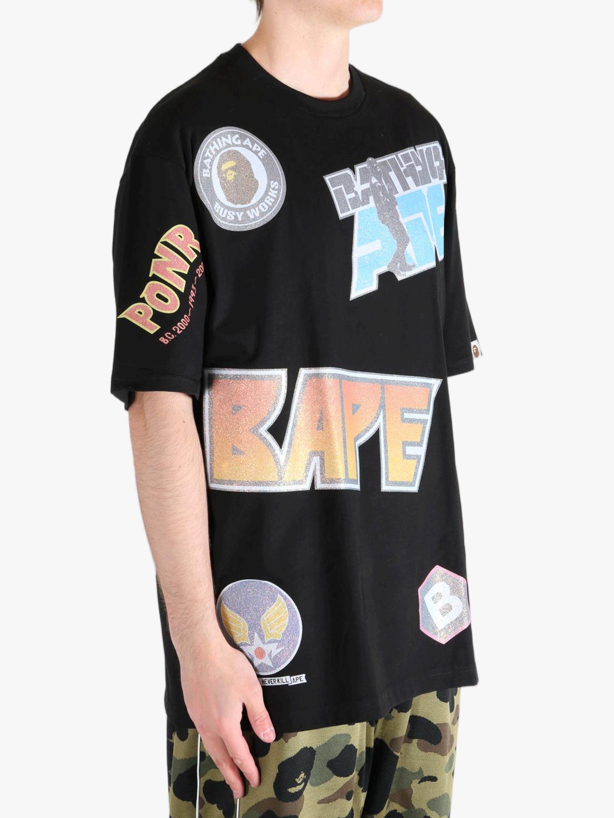 Black t-shirt worn by a person, showing the shirt's fit