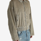 Tan jacket worn by a person, showing the jacket’s fit