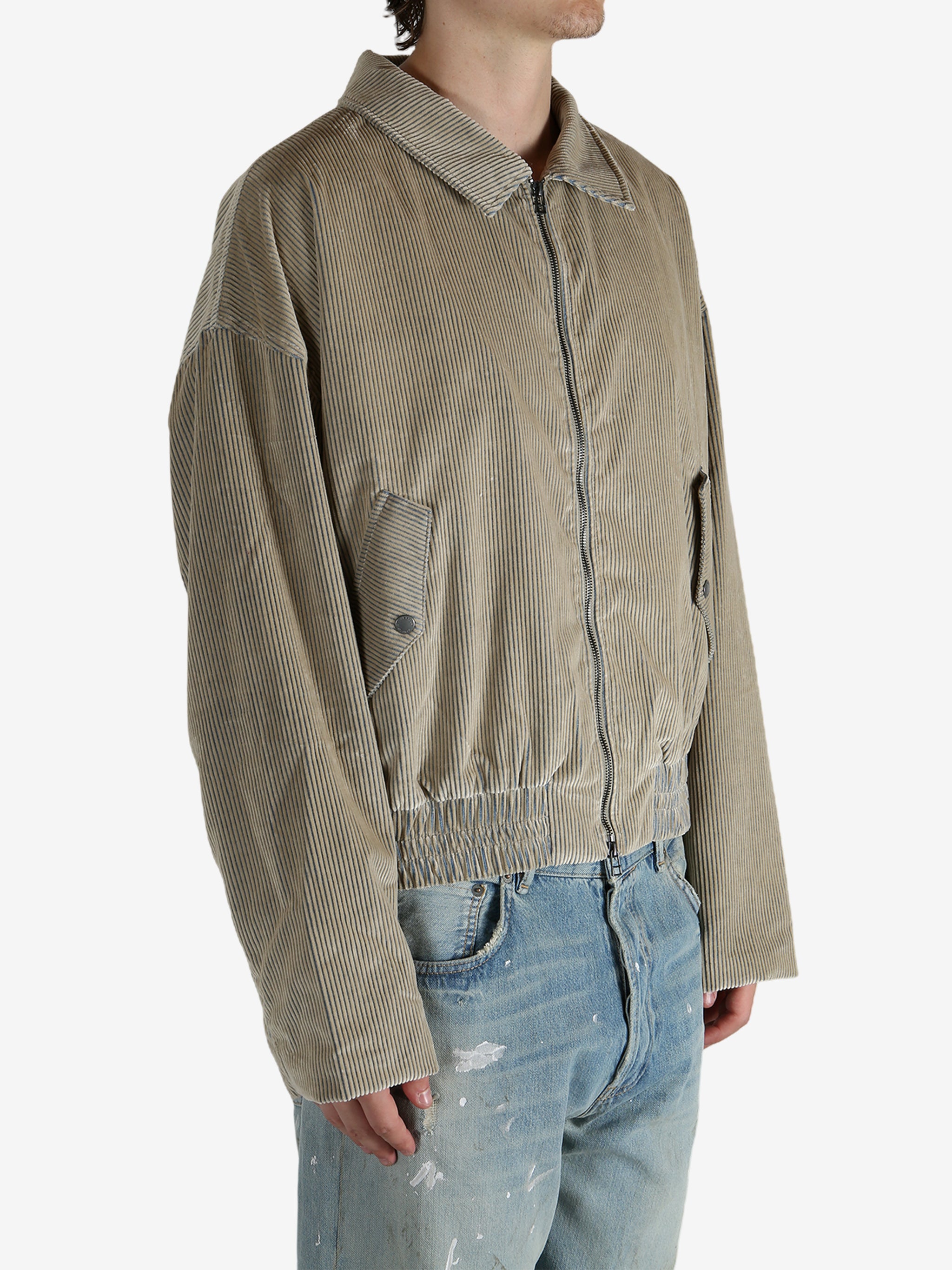 Tan jacket worn by a person, showing the jacket’s fit