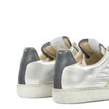 Close up of the grey sneakers, showing texture of the polyester and polyamide fabric