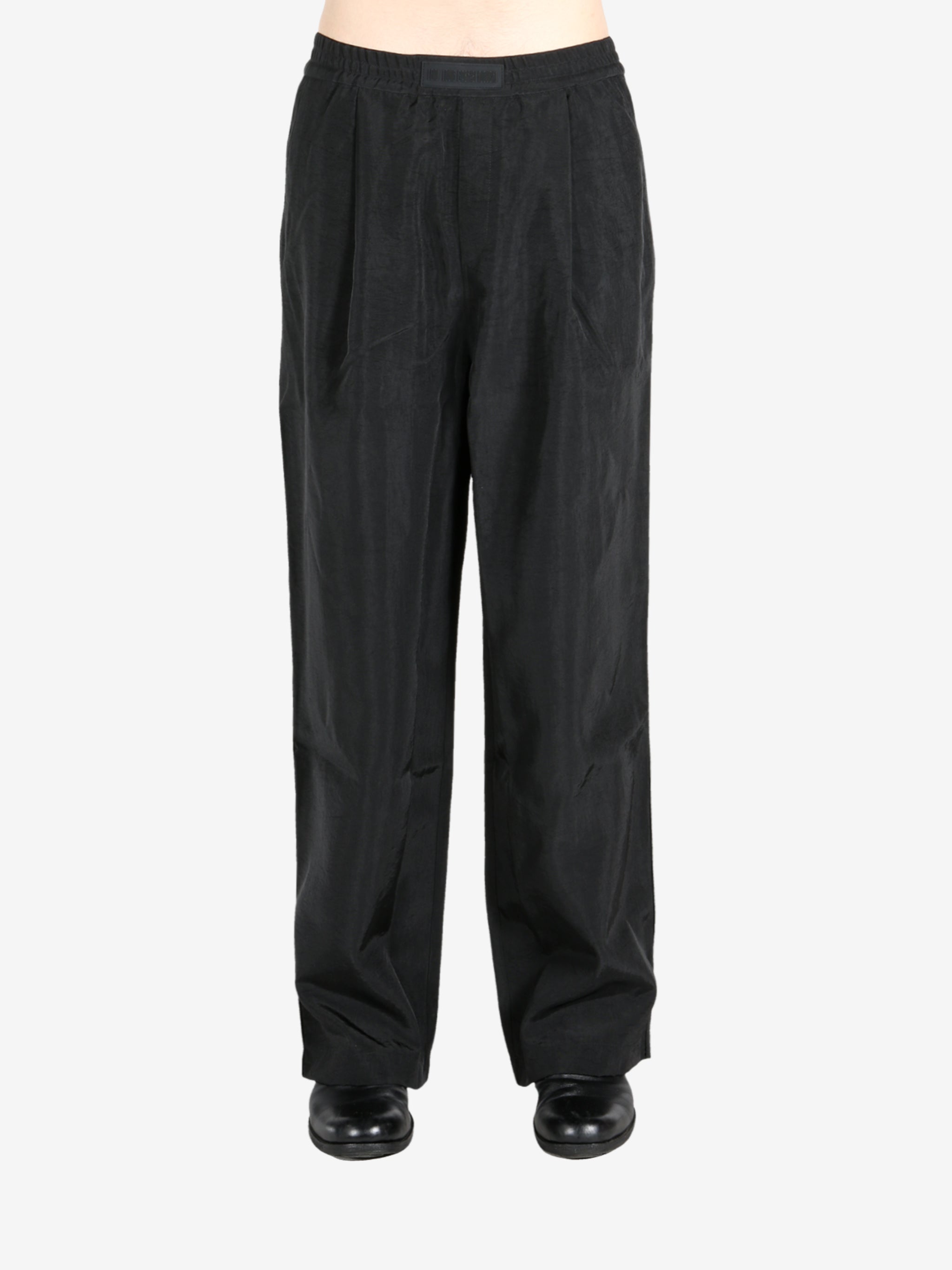 Black pant worn by a person, showing the pant’s fit