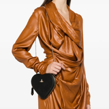 Black crossbody worn by a person, showing the crossbody's fit