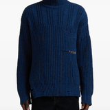 blue sweater worn by a person, showing the sweater fit