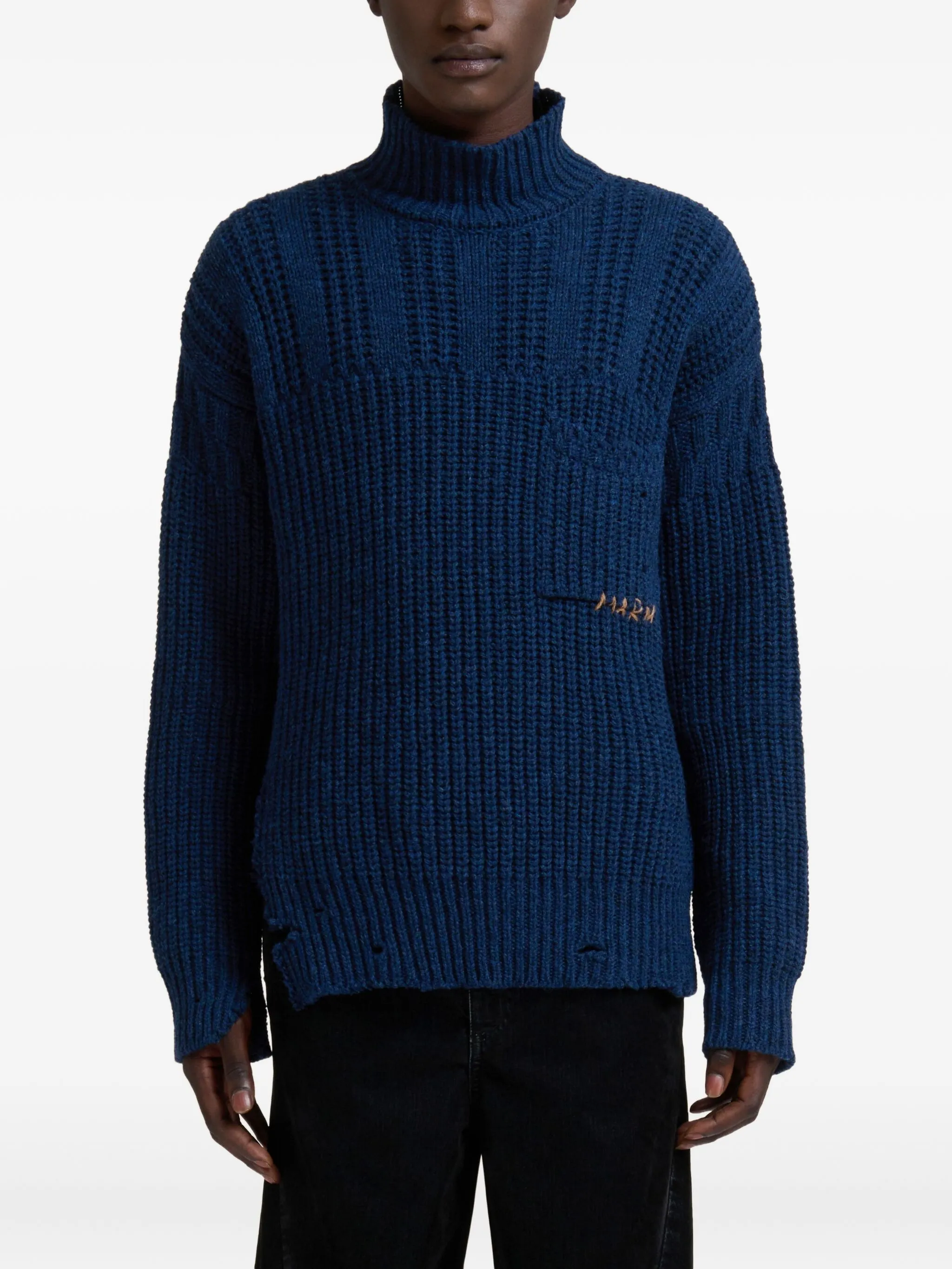 blue sweater worn by a person, showing the sweater fit
