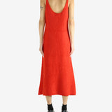 Red dress worn by a person, showing the dress's fit