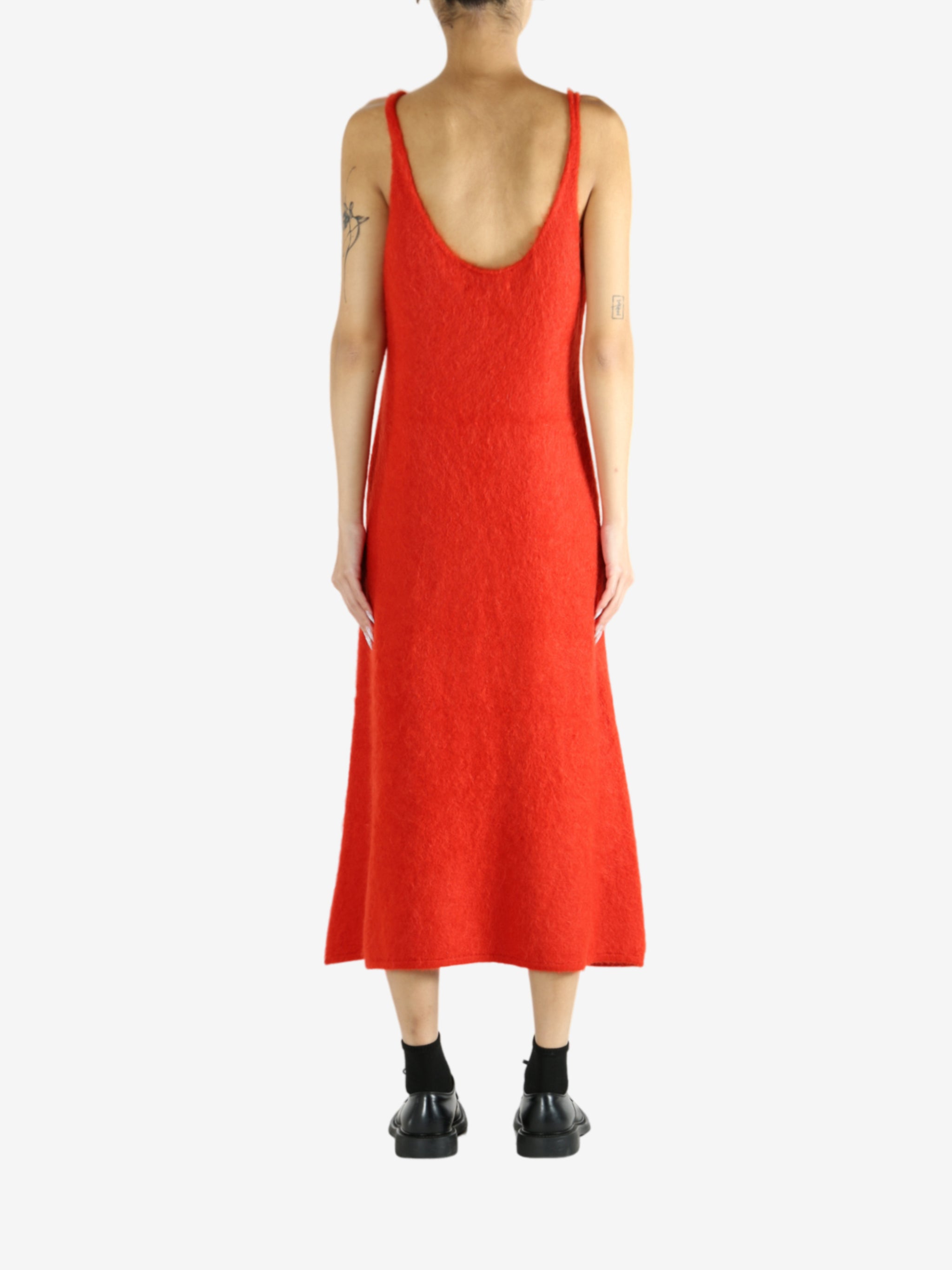 Red dress worn by a person, showing the dress's fit