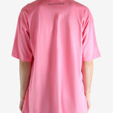 Pink t-shirt worn by a person, showing the shirt's fit