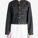 Black jacket worn by a person, showing the jacket fit