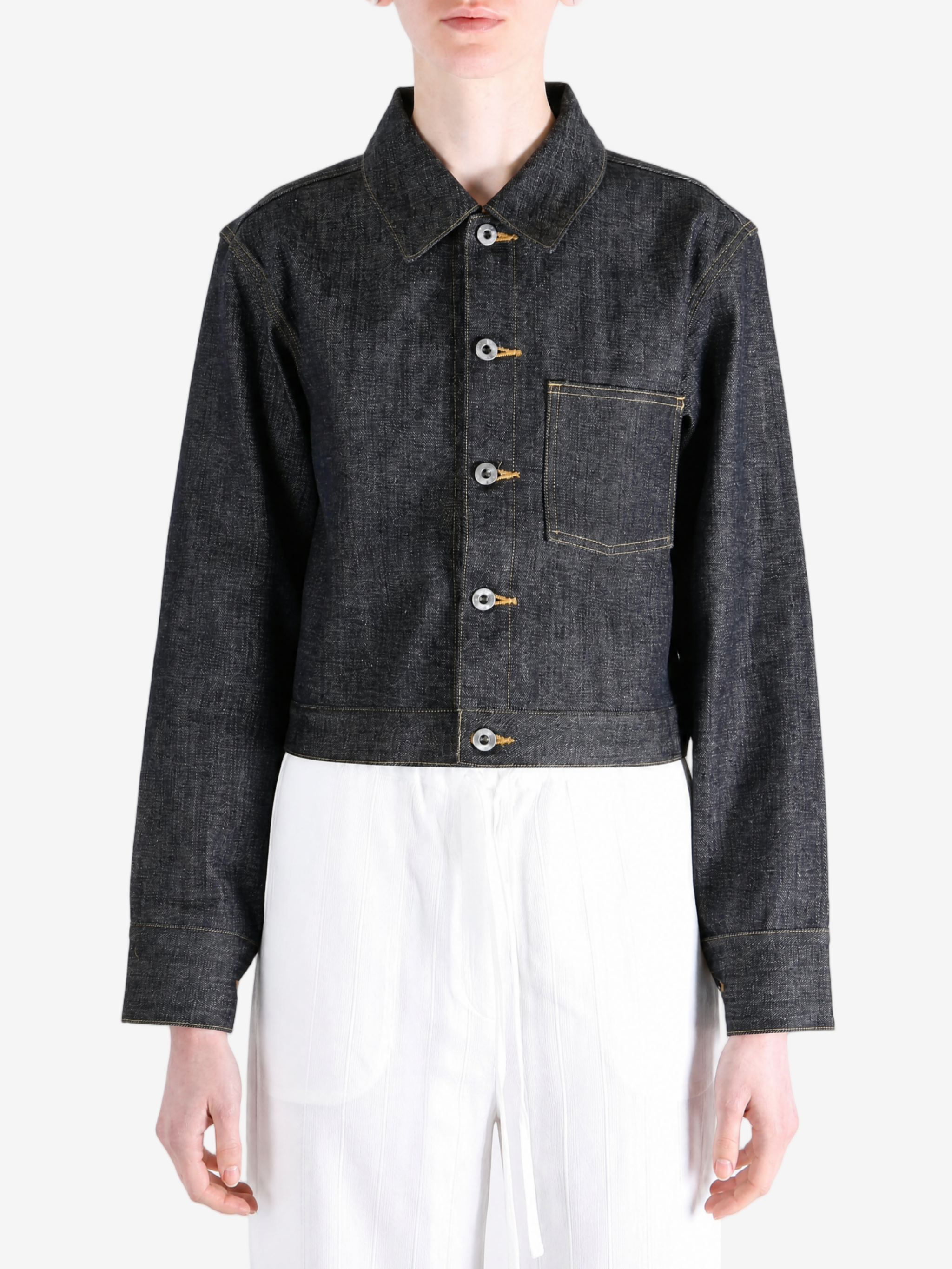 Black jacket worn by a person, showing the jacket fit