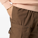 Close up of brown pants, showing texture of the cotton fabric