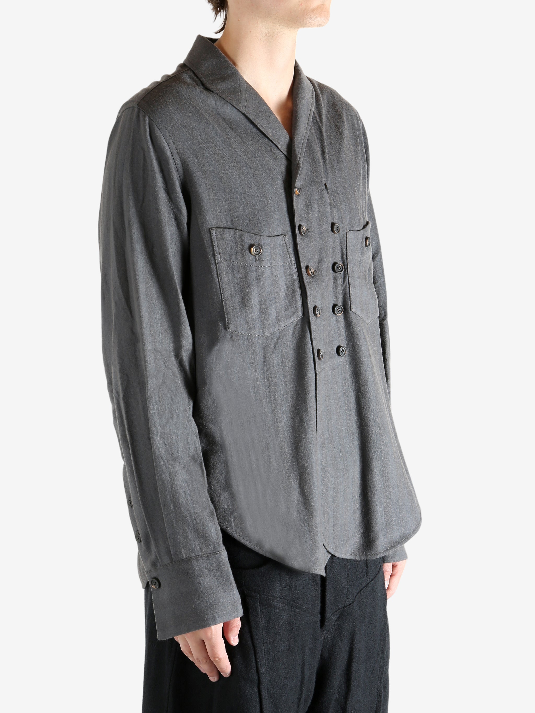 Grey shirt worn by a person. showing the shirt's fit