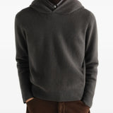 Grey knitwear worn by a person, showing the knitwear fit