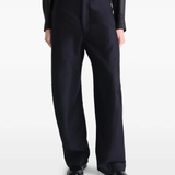 Black pant worn by a person, showing the pant's fit