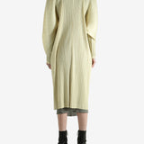 Yellow coat worn by a person, showing the coat's fit