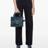 Blue bag worn by a person, showing the bag's fit
