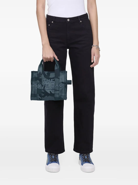 Blue bag worn by a person, showing the bag's fit