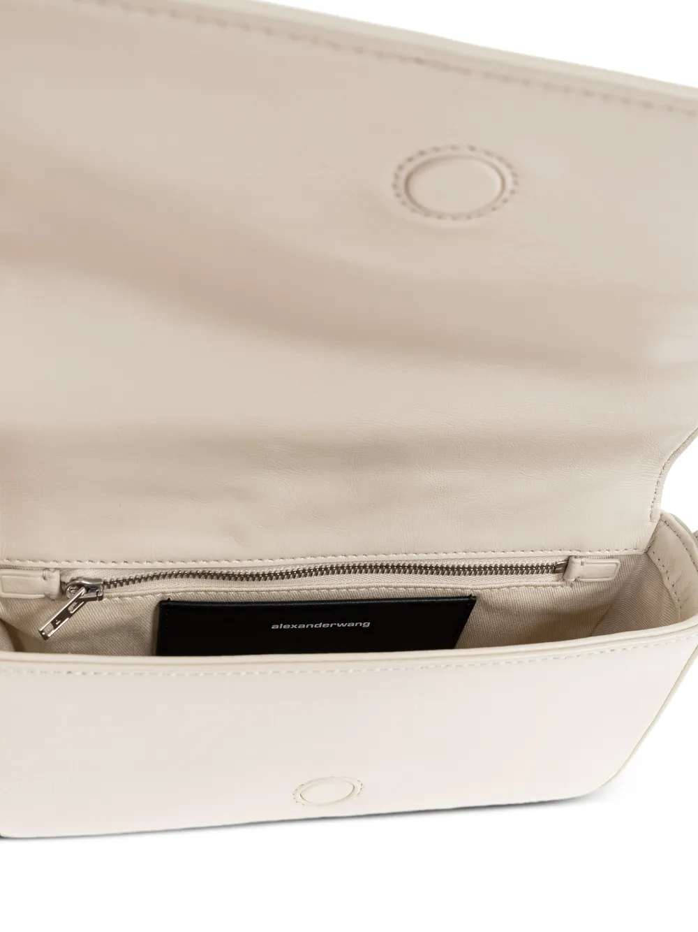 Close up of white handbag,showing texture of the leather fabric.