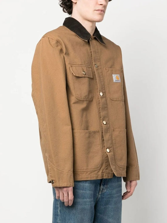 Tan coat worn by a person, showing the coat's fit