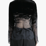 Black shirt worn by a person, showing the shirt fit