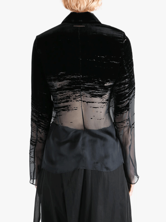 Black shirt worn by a person, showing the shirt fit