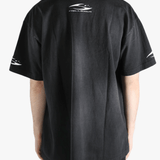 Black t-shirt worn by a person, showing the shirt's fit