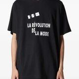 Black t-shirt worn by a person, showing the t-shirt fit