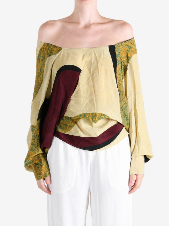 Yellow top worn by a person, showing the top fit