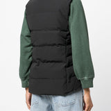 Black vest worn by a person, showing the vest's fit