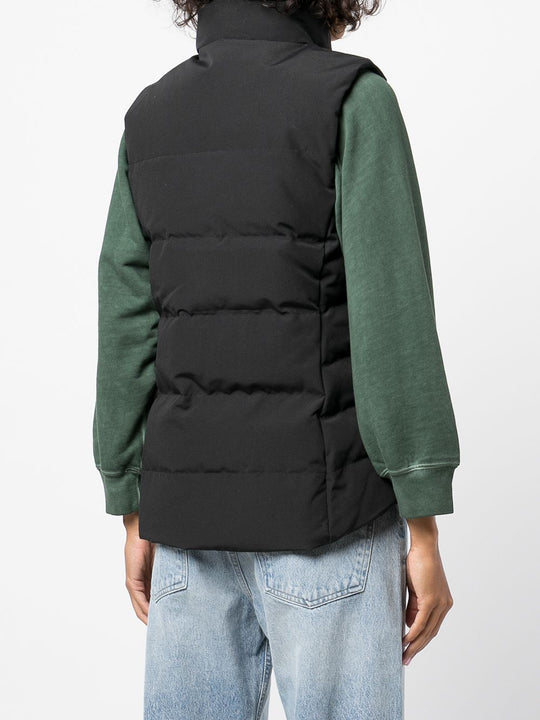 Black vest worn by a person, showing the vest's fit