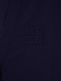 Close up of navy knitwear, showing texture of cashmere and silk fabric