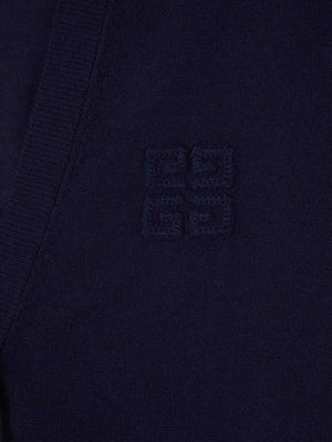 Close up of navy knitwear, showing texture of cashmere and silk fabric