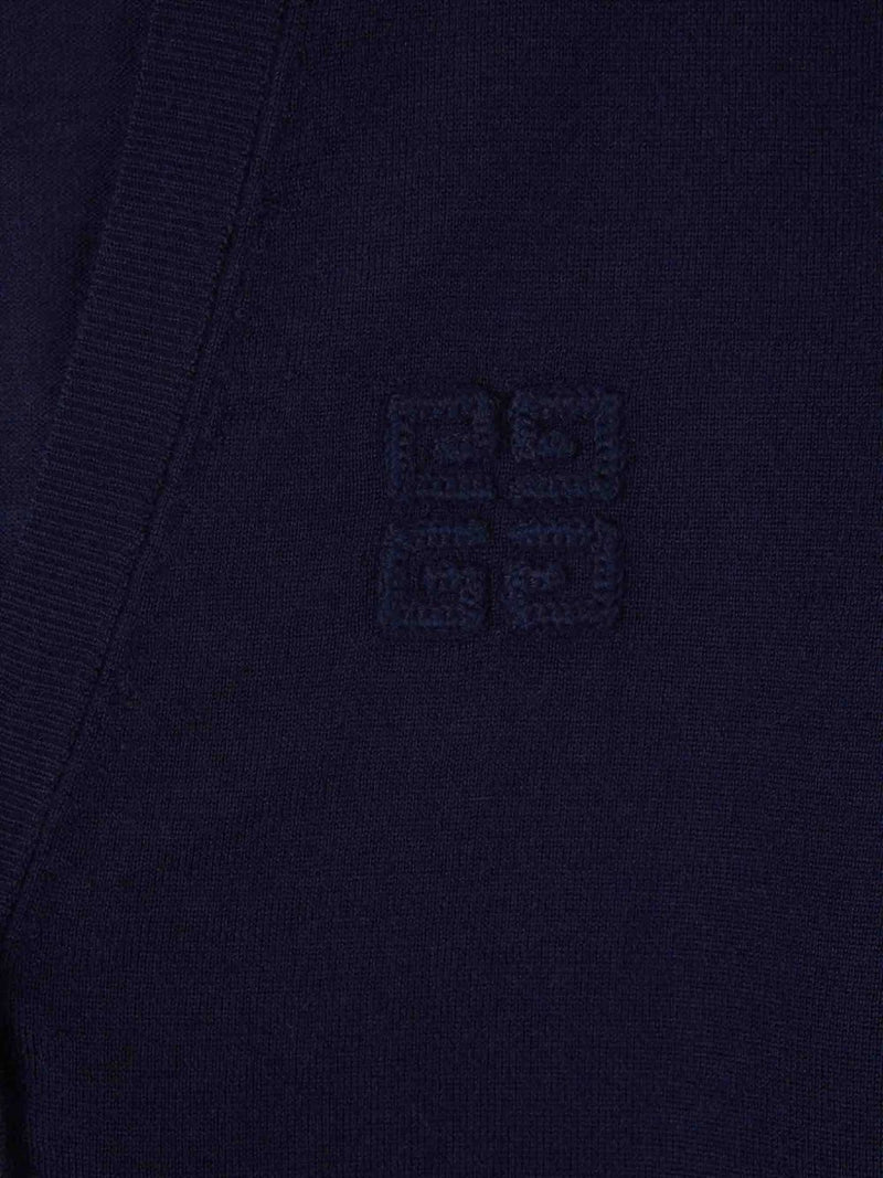 Close up of navy knitwear, showing texture of cashmere and silk fabric