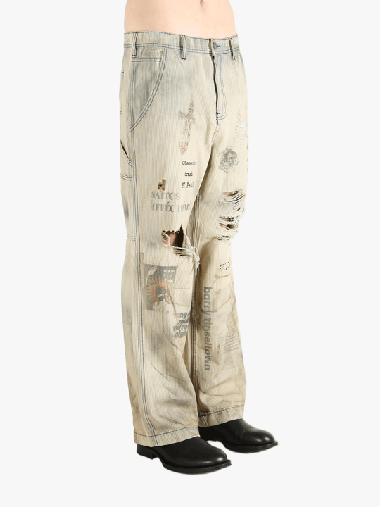 Grey pants worn by a person, showing the pants fit