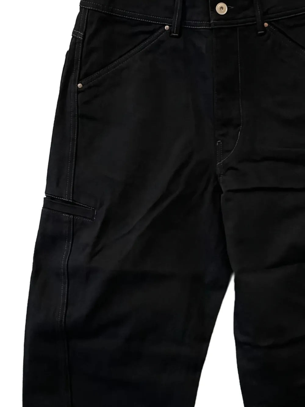Close up of the black pants, showing texture of the cotton fabric
