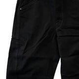 Close up of the black pants, showing texture of the cotton fabric