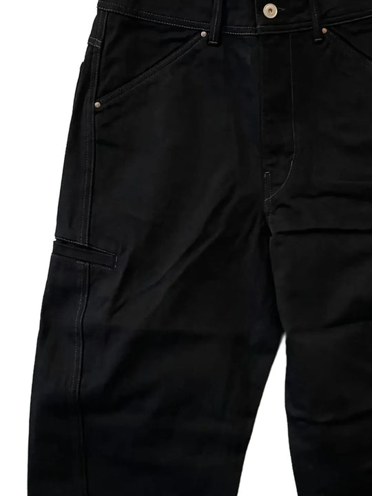 Close up of the black pants, showing texture of the cotton fabric