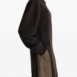 Brown sweater worn by a person, showing the sweater's fit