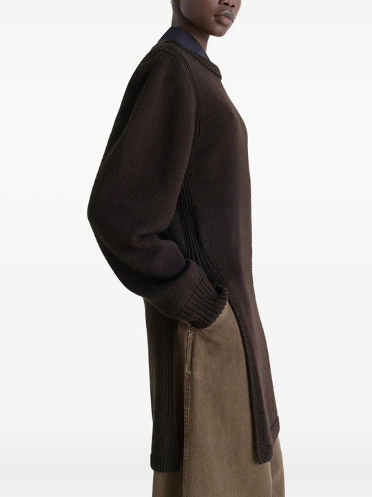 Brown sweater worn by a person, showing the sweater's fit
