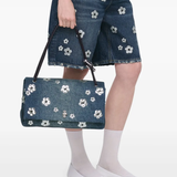 Blue bag worn by a person, showing the bag fit