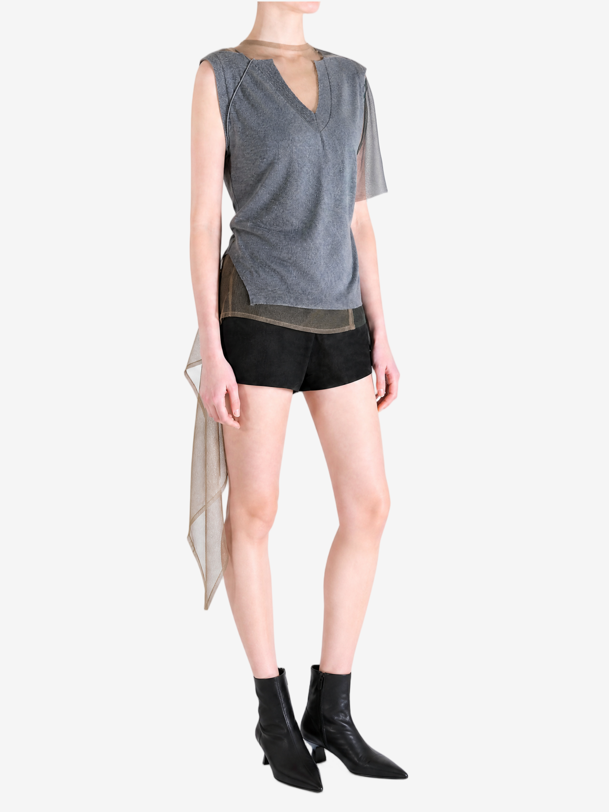 grey shirt worn by a person, showing the shirt fit