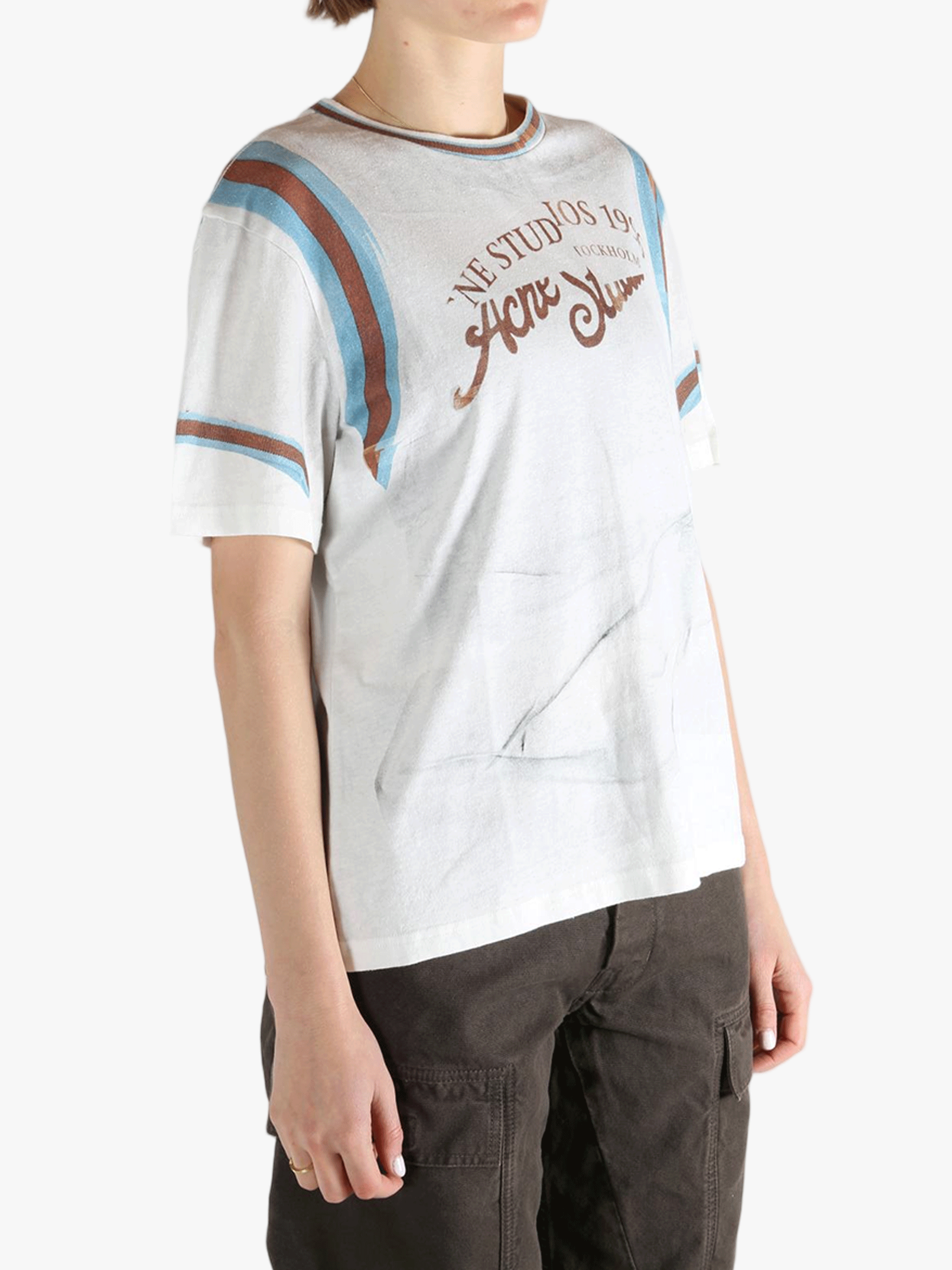 White T-shirt worn by a person, showing the T-shirt's fit