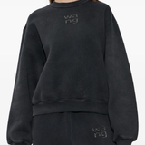 Black sweatshirt worn by a person, showing the sweatshirt fit