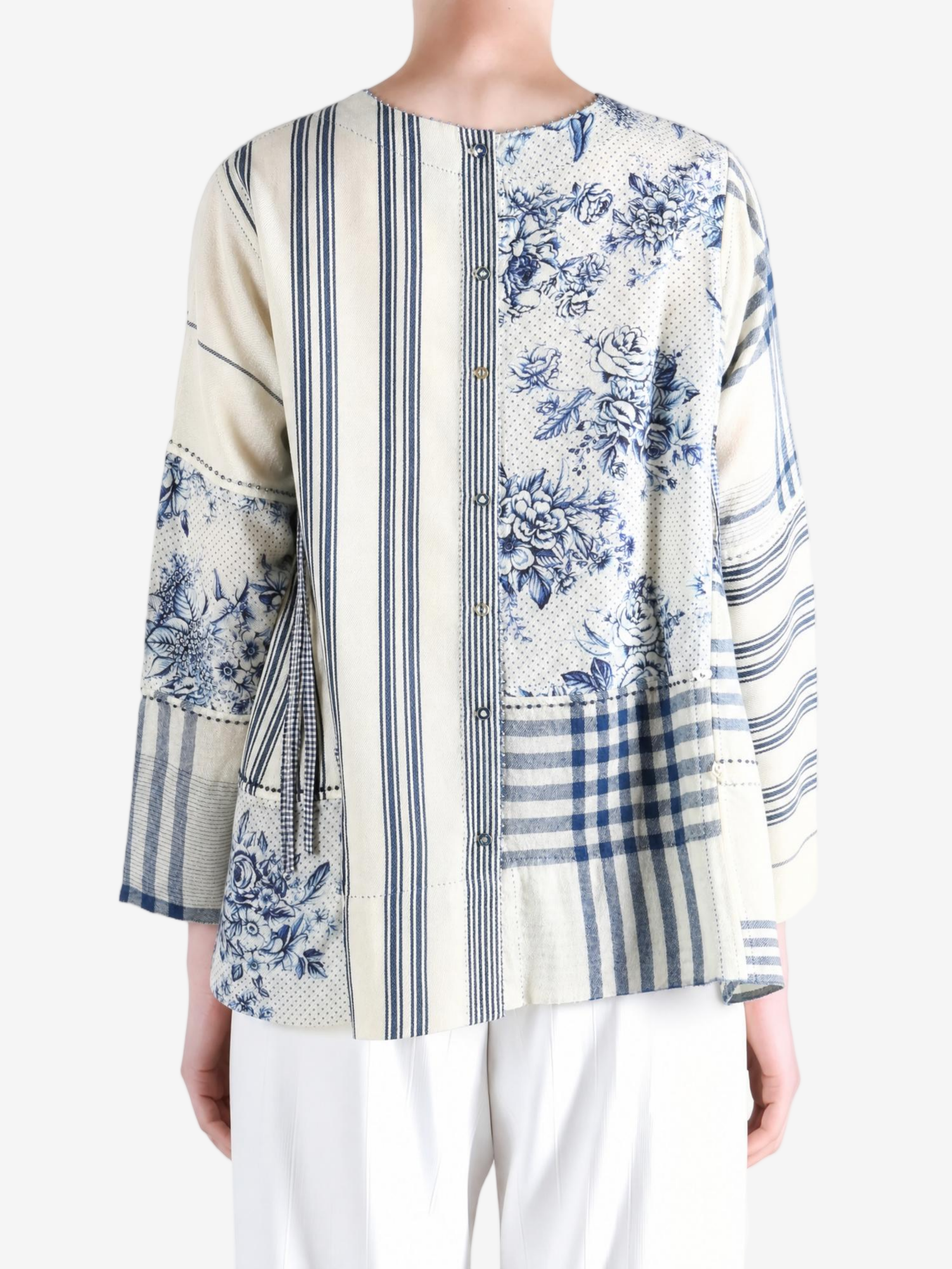 Blue top worn by a person, showing the top fit